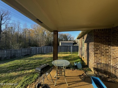 Welcome to your dream home at 990 Clubhouse Drive! in Pearl's on Patrick Farms Golf Club in Mississippi - for sale on GolfHomes.com, golf home, golf lot