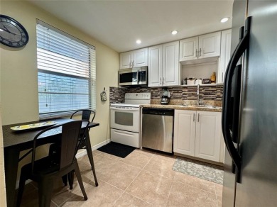 Discover easy South Florida living in this beautifully updated on Oriole Golf and Tennis Club in Florida - for sale on GolfHomes.com, golf home, golf lot