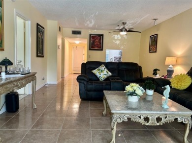 Discover easy South Florida living in this beautifully updated on Oriole Golf and Tennis Club in Florida - for sale on GolfHomes.com, golf home, golf lot