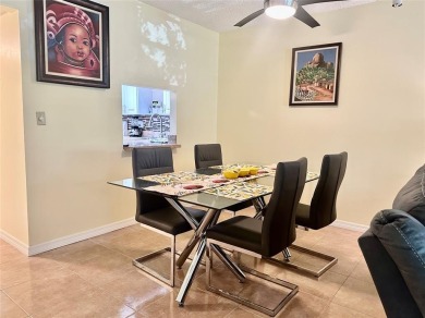 Discover easy South Florida living in this beautifully updated on Oriole Golf and Tennis Club in Florida - for sale on GolfHomes.com, golf home, golf lot