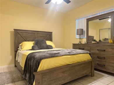 Discover easy South Florida living in this beautifully updated on Oriole Golf and Tennis Club in Florida - for sale on GolfHomes.com, golf home, golf lot