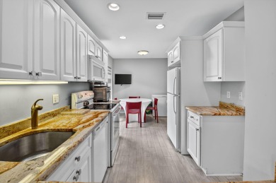 Welcome to your charming first-floor corner unit with beautiful on Hunters Run Golf and Country Club in Florida - for sale on GolfHomes.com, golf home, golf lot