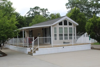 Relax & enjoy yourself. This charming 2004 cottage comes with on Marquette Trails Country Club in Michigan - for sale on GolfHomes.com, golf home, golf lot