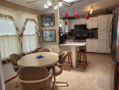 This very well-maintained pet free 3-bedroom 2 bath home in on Zellwood Station Country Club in Florida - for sale on GolfHomes.com, golf home, golf lot