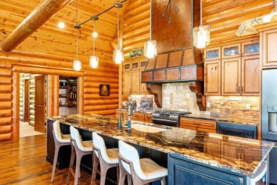 Welcome to 6 Donegal Drive -- a stunning custom log home tucked on The Powder Horn Golf Club - Mountain in Wyoming - for sale on GolfHomes.com, golf home, golf lot