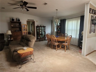 This very well-maintained pet free 3-bedroom 2 bath home in on Zellwood Station Country Club in Florida - for sale on GolfHomes.com, golf home, golf lot