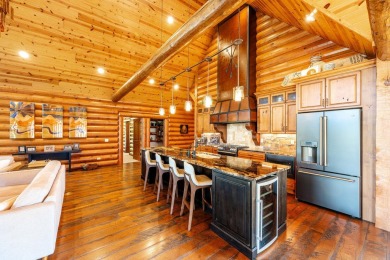 Welcome to 6 Donegal Drive -- a stunning custom log home tucked on The Powder Horn Golf Club - Mountain in Wyoming - for sale on GolfHomes.com, golf home, golf lot
