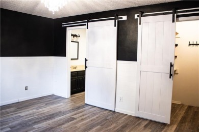 Enjoy relaxed lake living in this beautifully updated tri-level on Holiday Island Executive Golf Course in Arkansas - for sale on GolfHomes.com, golf home, golf lot