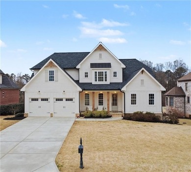 Welcome to a home that truly raises the bar in Traditions of on Traditions of Braselton Golf Club in Georgia - for sale on GolfHomes.com, golf home, golf lot