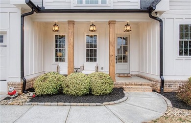 Welcome to a home that truly raises the bar in Traditions of on Traditions of Braselton Golf Club in Georgia - for sale on GolfHomes.com, golf home, golf lot