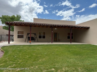 Quality home on the 11th fairway featuring 12 foot ceilings, gas on San Juan Country Club in New Mexico - for sale on GolfHomes.com, golf home, golf lot