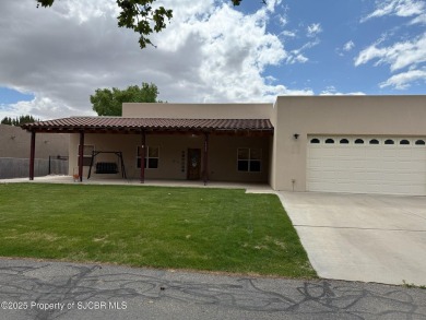 Quality home on the 11th fairway featuring 12 foot ceilings, gas on San Juan Country Club in New Mexico - for sale on GolfHomes.com, golf home, golf lot