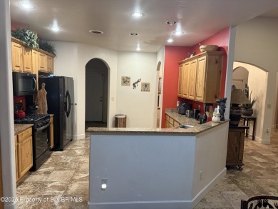 Quality home on the 11th fairway featuring 12 foot ceilings, gas on San Juan Country Club in New Mexico - for sale on GolfHomes.com, golf home, golf lot
