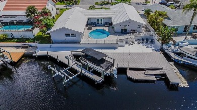Coastal luxury meets resort-style living in this updated 3,000 on Gulf Harbors Golf Course in Florida - for sale on GolfHomes.com, golf home, golf lot