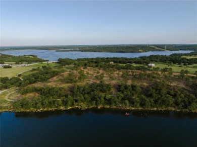 Enjoy 2.0 acres of lakeside tranquility tucked away in a cove on Twisted Oaks Golf Club in Texas - for sale on GolfHomes.com, golf home, golf lot