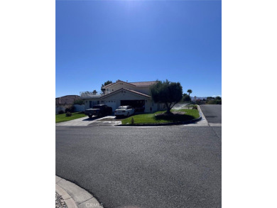 Beautifully maintained and cared for 5 bedroom 3 bath home in on Spring Valley Lake Country Club in California - for sale on GolfHomes.com, golf home, golf lot