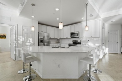 Discover elevated maintenance free Florida living in this on Sarasota National Golf Club in Florida - for sale on GolfHomes.com, golf home, golf lot