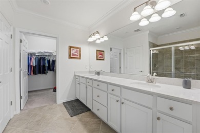 Discover elevated maintenance free Florida living in this on Sarasota National Golf Club in Florida - for sale on GolfHomes.com, golf home, golf lot