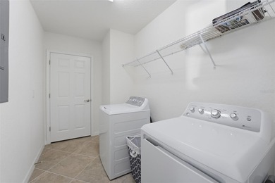 Discover elevated maintenance free Florida living in this on Sarasota National Golf Club in Florida - for sale on GolfHomes.com, golf home, golf lot