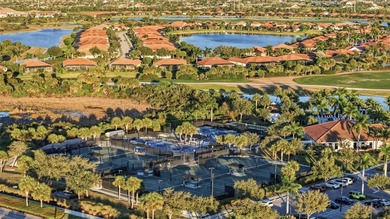 Discover elevated maintenance free Florida living in this on Sarasota National Golf Club in Florida - for sale on GolfHomes.com, golf home, golf lot