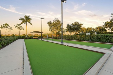 Discover elevated maintenance free Florida living in this on Sarasota National Golf Club in Florida - for sale on GolfHomes.com, golf home, golf lot