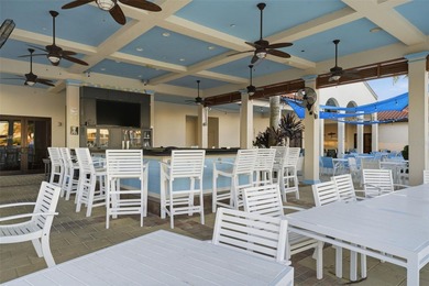 Discover elevated maintenance free Florida living in this on Sarasota National Golf Club in Florida - for sale on GolfHomes.com, golf home, golf lot