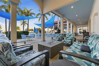 Discover elevated maintenance free Florida living in this on Sarasota National Golf Club in Florida - for sale on GolfHomes.com, golf home, golf lot