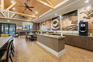 Discover elevated maintenance free Florida living in this on Sarasota National Golf Club in Florida - for sale on GolfHomes.com, golf home, golf lot