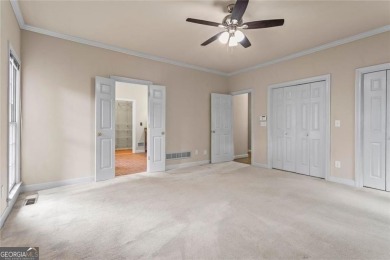 Easy Living in The Spinnakers of Windward! Downsize without on The Golf Club of Georgia in Georgia - for sale on GolfHomes.com, golf home, golf lot