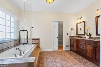 Easy Living in The Spinnakers of Windward! Downsize without on The Golf Club of Georgia in Georgia - for sale on GolfHomes.com, golf home, golf lot