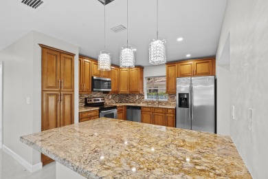 Beautifully updated 3BR/2BA, 1,716 sq ft home on a private on Boca Greens Country Club in Florida - for sale on GolfHomes.com, golf home, golf lot