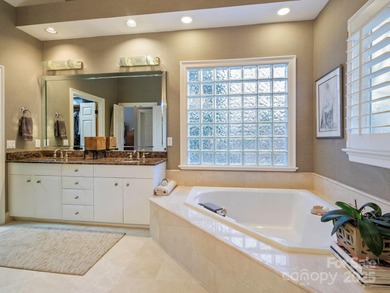 Exquisite Custom-built Estate, perfectly nestled in the on TPC at Piper Glen in North Carolina - for sale on GolfHomes.com, golf home, golf lot