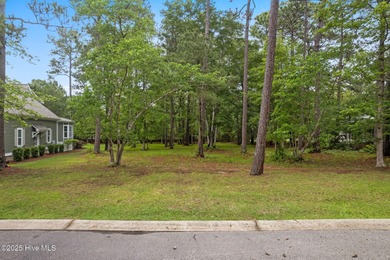 This quiet lot is tucked away on a cul-de-sac in the prestigious on Rivers Edge Golf Club in North Carolina - for sale on GolfHomes.com, golf home, golf lot