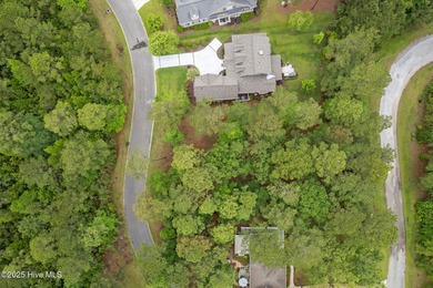 This quiet lot is tucked away on a cul-de-sac in the prestigious on Rivers Edge Golf Club in North Carolina - for sale on GolfHomes.com, golf home, golf lot