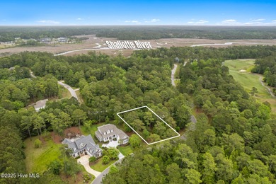 This quiet lot is tucked away on a cul-de-sac in the prestigious on Rivers Edge Golf Club in North Carolina - for sale on GolfHomes.com, golf home, golf lot