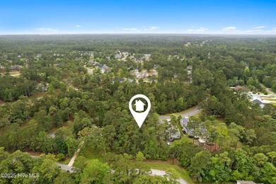 This quiet lot is tucked away on a cul-de-sac in the prestigious on Rivers Edge Golf Club in North Carolina - for sale on GolfHomes.com, golf home, golf lot