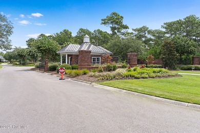 This quiet lot is tucked away on a cul-de-sac in the prestigious on Rivers Edge Golf Club in North Carolina - for sale on GolfHomes.com, golf home, golf lot