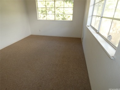 Situated on a nicely sized flag lot in Ewa Villages close to on Coral Creek Golf Course in Hawaii - for sale on GolfHomes.com, golf home, golf lot