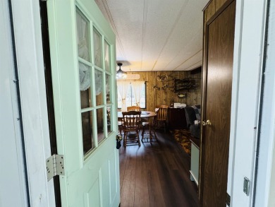 Welcome to your Lake Arrowhead getaway! This charming mobile on Sand Valley Golf Course in Wisconsin - for sale on GolfHomes.com, golf home, golf lot