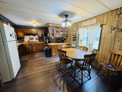 Welcome to your Lake Arrowhead getaway! This charming mobile on Sand Valley Golf Course in Wisconsin - for sale on GolfHomes.com, golf home, golf lot