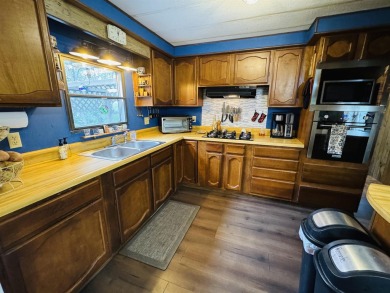 Welcome to your Lake Arrowhead getaway! This charming mobile on Sand Valley Golf Course in Wisconsin - for sale on GolfHomes.com, golf home, golf lot