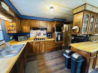 Welcome to your Lake Arrowhead getaway! This charming mobile on Sand Valley Golf Course in Wisconsin - for sale on GolfHomes.com, golf home, golf lot