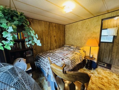Welcome to your Lake Arrowhead getaway! This charming mobile on Sand Valley Golf Course in Wisconsin - for sale on GolfHomes.com, golf home, golf lot