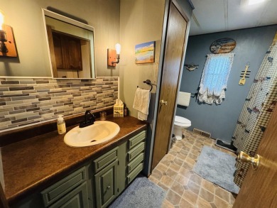 Welcome to your Lake Arrowhead getaway! This charming mobile on Sand Valley Golf Course in Wisconsin - for sale on GolfHomes.com, golf home, golf lot