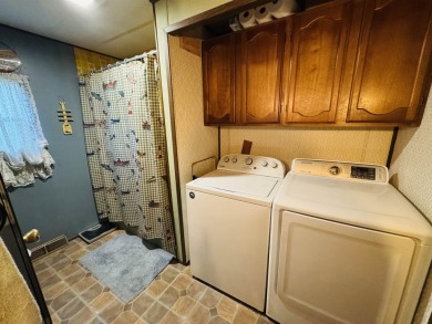 Welcome to your Lake Arrowhead getaway! This charming mobile on Sand Valley Golf Course in Wisconsin - for sale on GolfHomes.com, golf home, golf lot