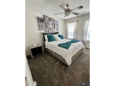 This stunning end-unit townhome in the Magnolia Green community on The Westham Golf Club At Magnolia Green in Virginia - for sale on GolfHomes.com, golf home, golf lot