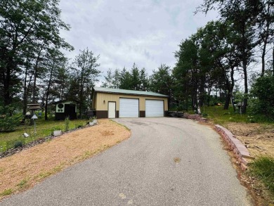 Welcome to your Lake Arrowhead getaway! This charming mobile on Sand Valley Golf Course in Wisconsin - for sale on GolfHomes.com, golf home, golf lot