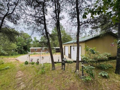 Welcome to your Lake Arrowhead getaway! This charming mobile on Sand Valley Golf Course in Wisconsin - for sale on GolfHomes.com, golf home, golf lot