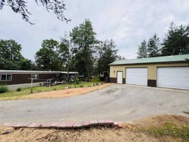 Welcome to your Lake Arrowhead getaway! This charming mobile on Sand Valley Golf Course in Wisconsin - for sale on GolfHomes.com, golf home, golf lot