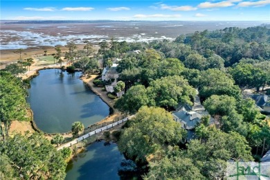 From stunning curb appeal to breathtaking views across 2 lagoons on The Landings Club - Palmetto in Georgia - for sale on GolfHomes.com, golf home, golf lot